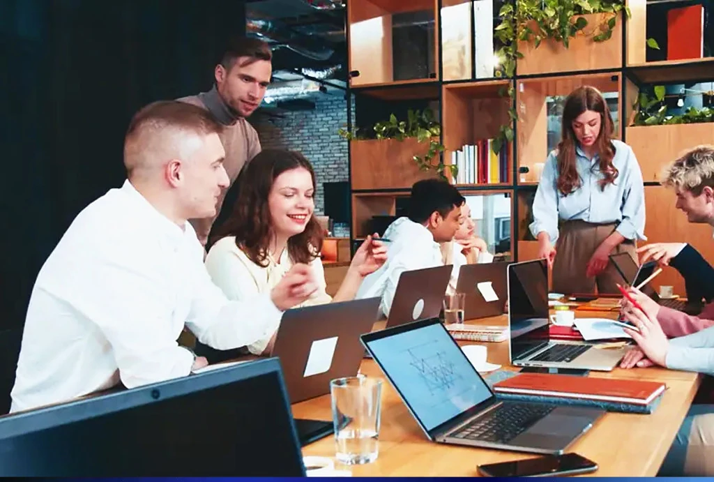 GMS team discussing a project in the office